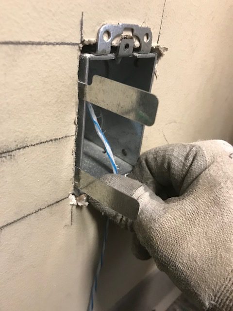 jiffy clip inserted into the wall